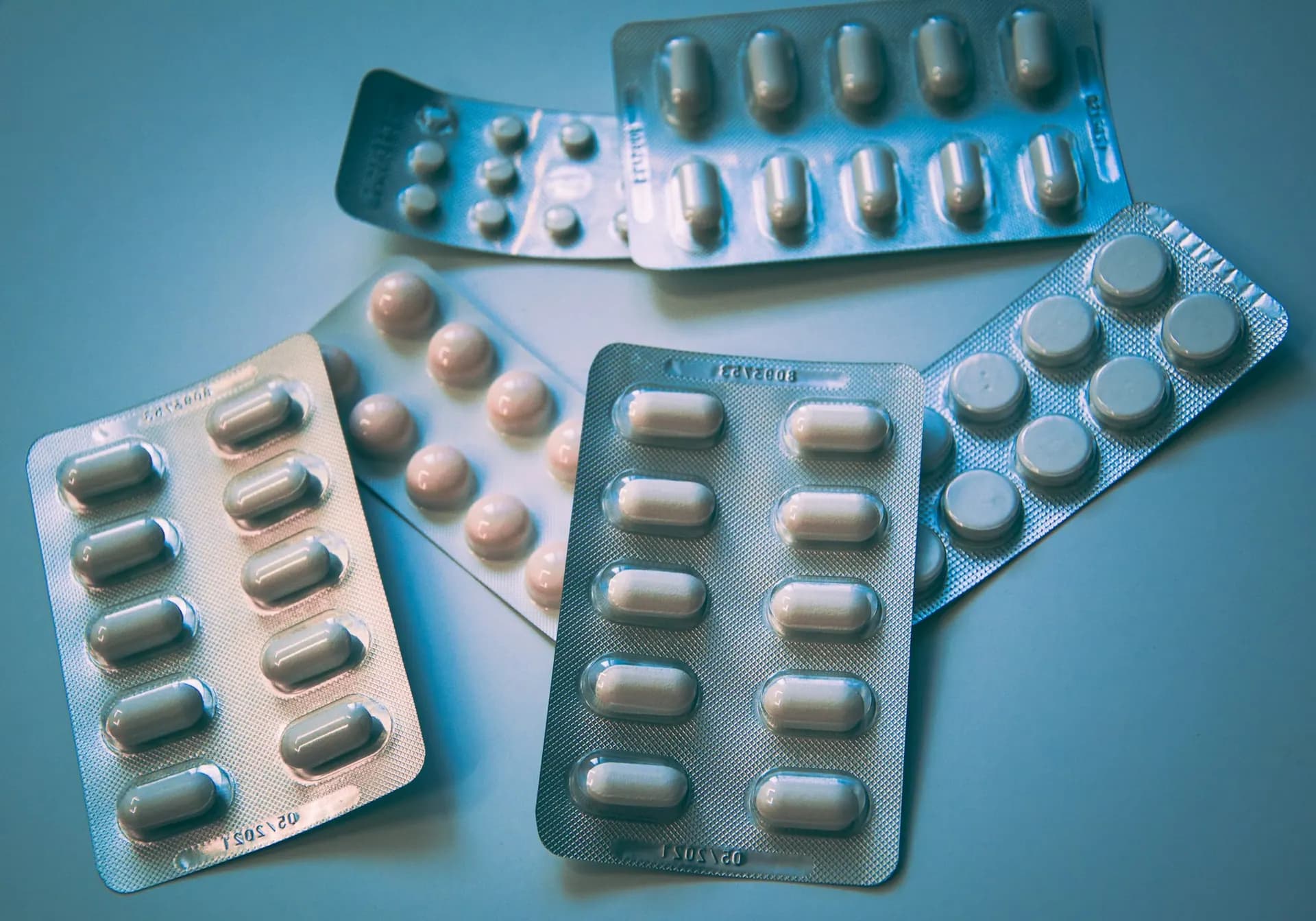 Blister packs on a blue background