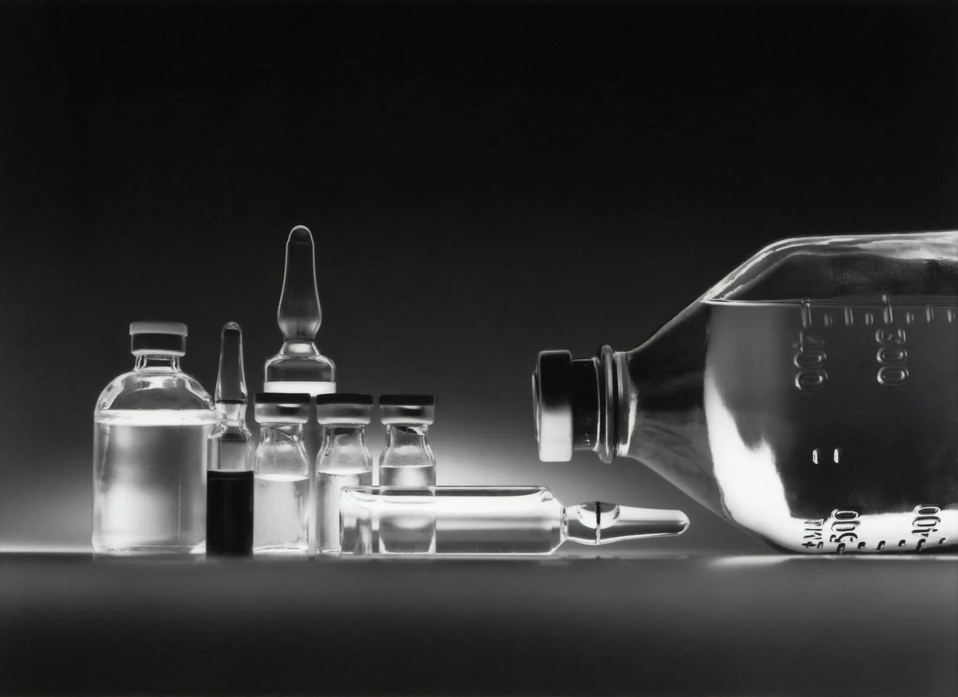IV bottle and vials on a clinic table